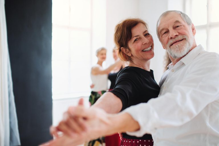 Senior,Couple,Attending,Dancing,Class,In,Community,Center.