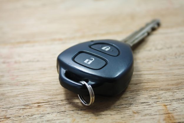 Car key on wooden background