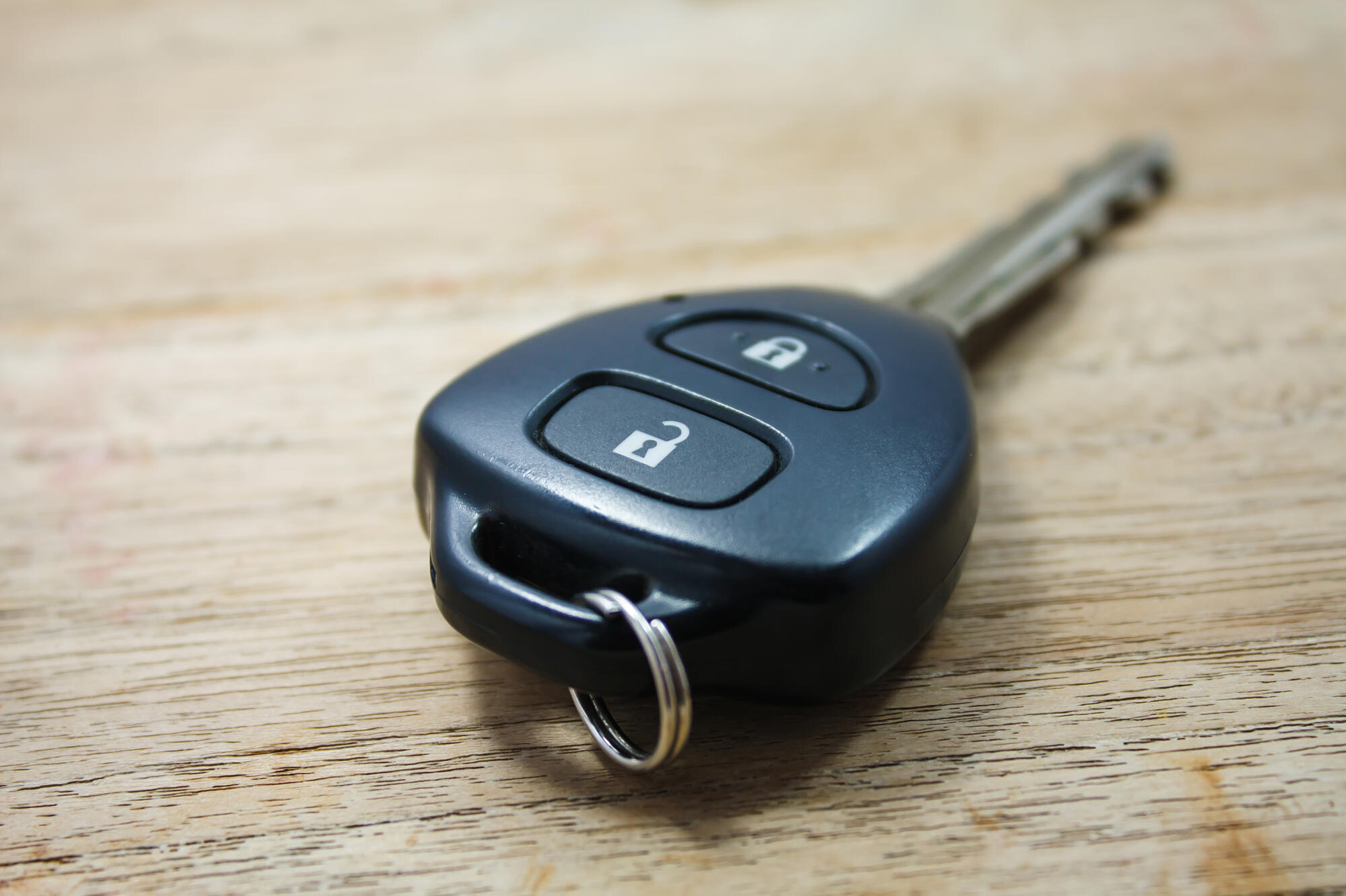 Car key on wooden background Car key on wooden background