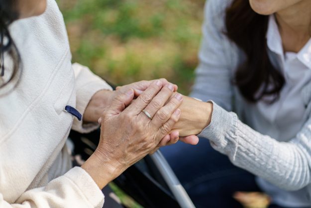 Family relationship Asian senior woman in wheelchair with happy