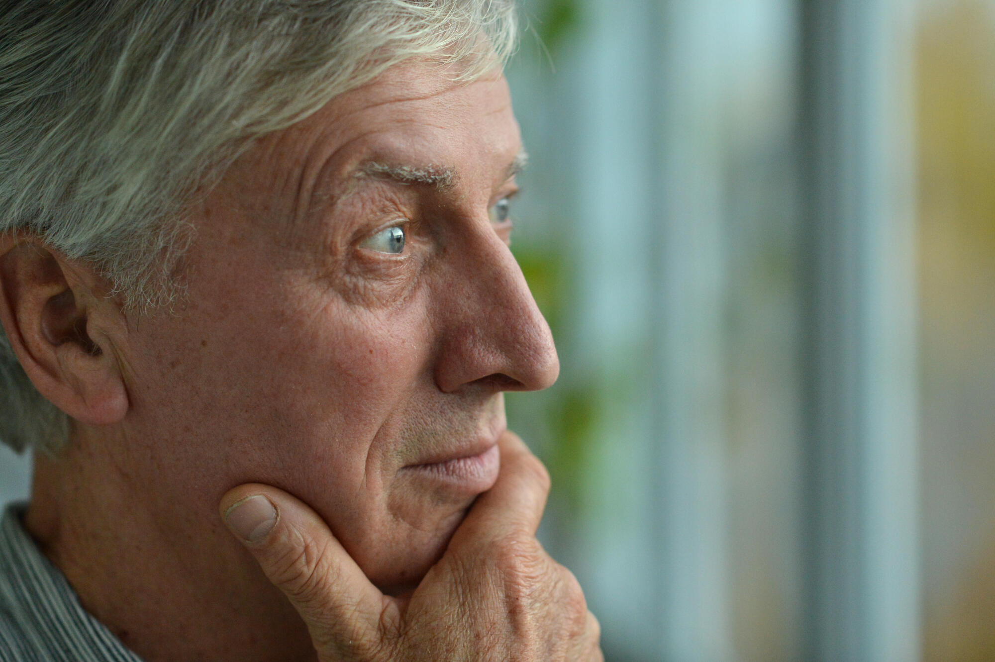 Close up portrait of a senior man thinking Close up portrait of a senior man thinking