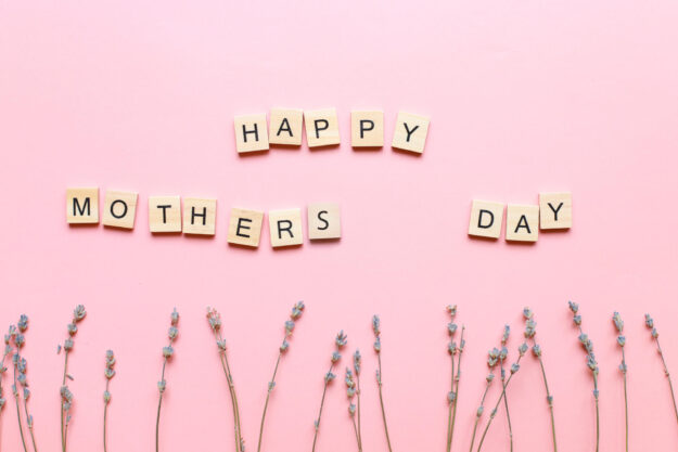 Happy mothers day. An inscription made of letters. Flatlay moms