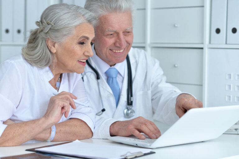 Portrait of professional doctors working in cabinet