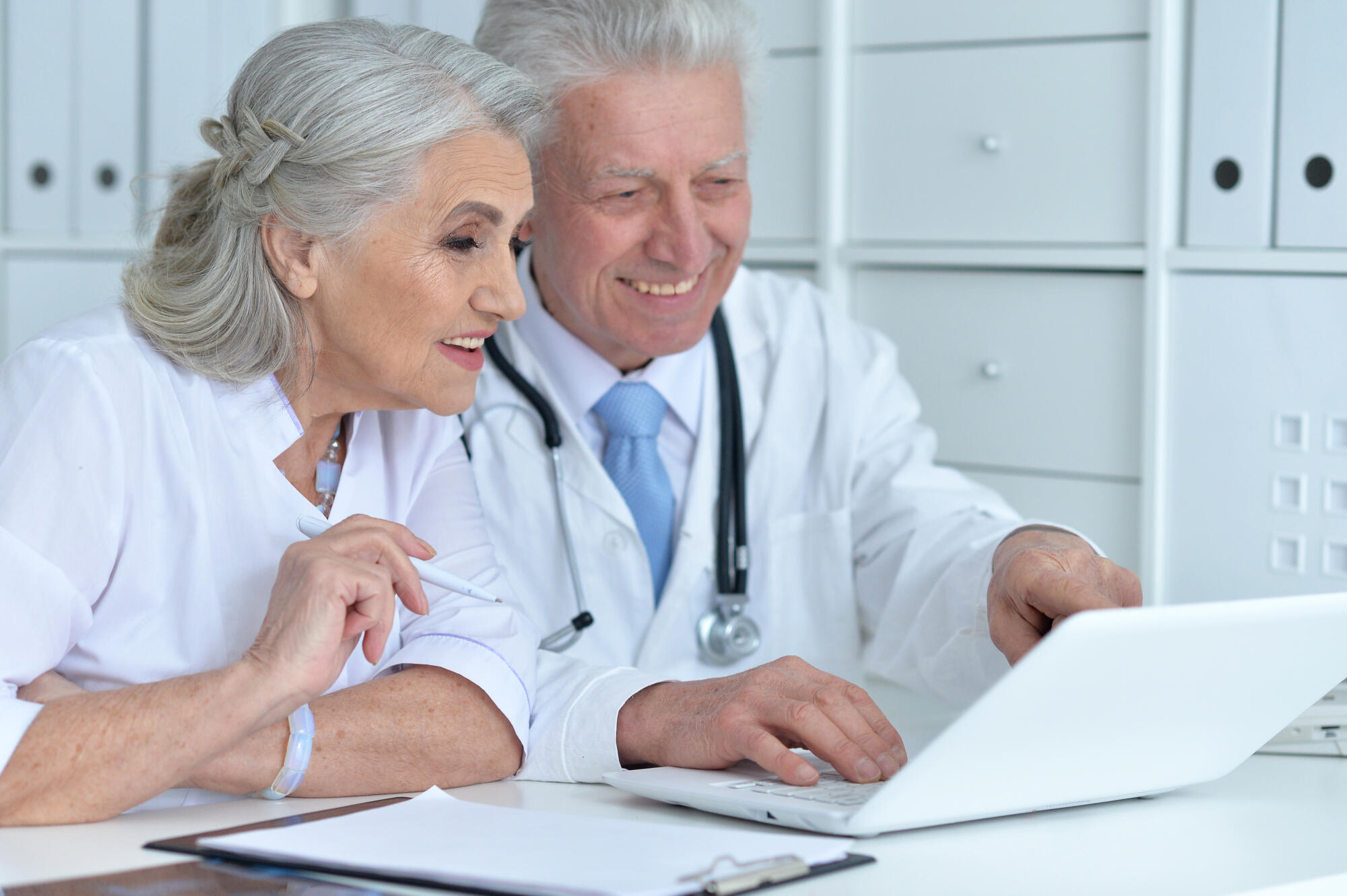 Portrait of professional doctors working in cabinet