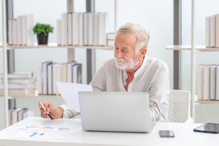Senior man checking their bills, retired elderly old family read