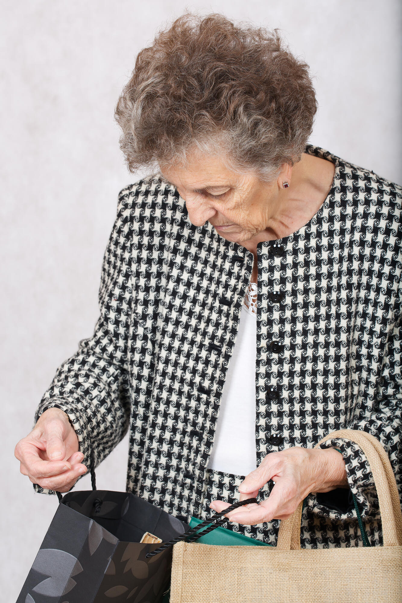 Old woman with shopping bags