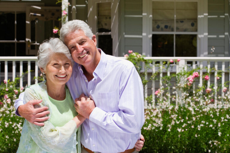 Portrait,Of,A,Senior,Couple,Standing,In,The,Summer,Garden