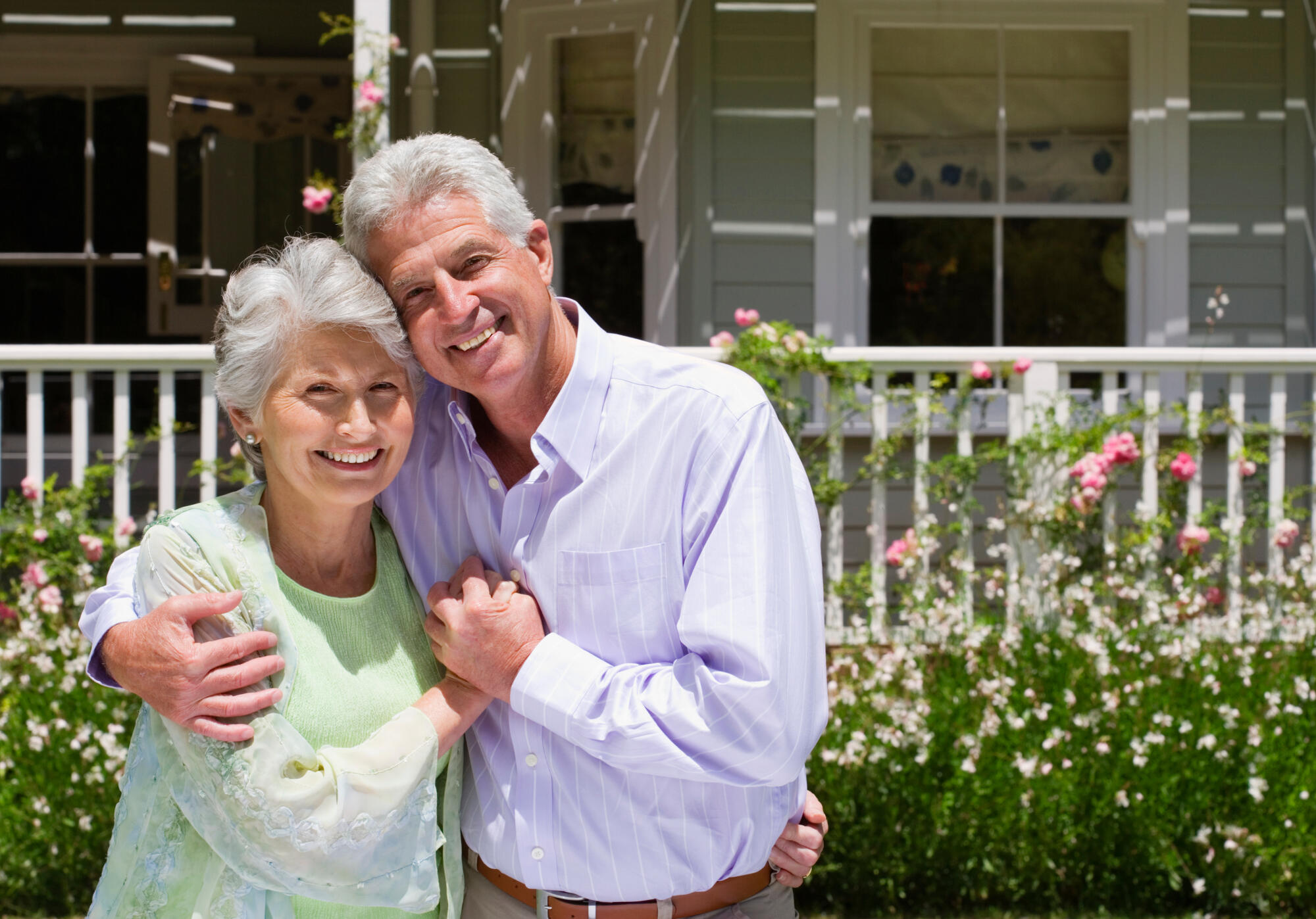 Portrait,Of,A,Senior,Couple,Standing,In,The,Summer,Garden