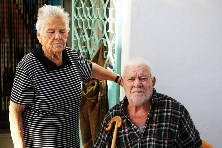 man sitting on the chair besid