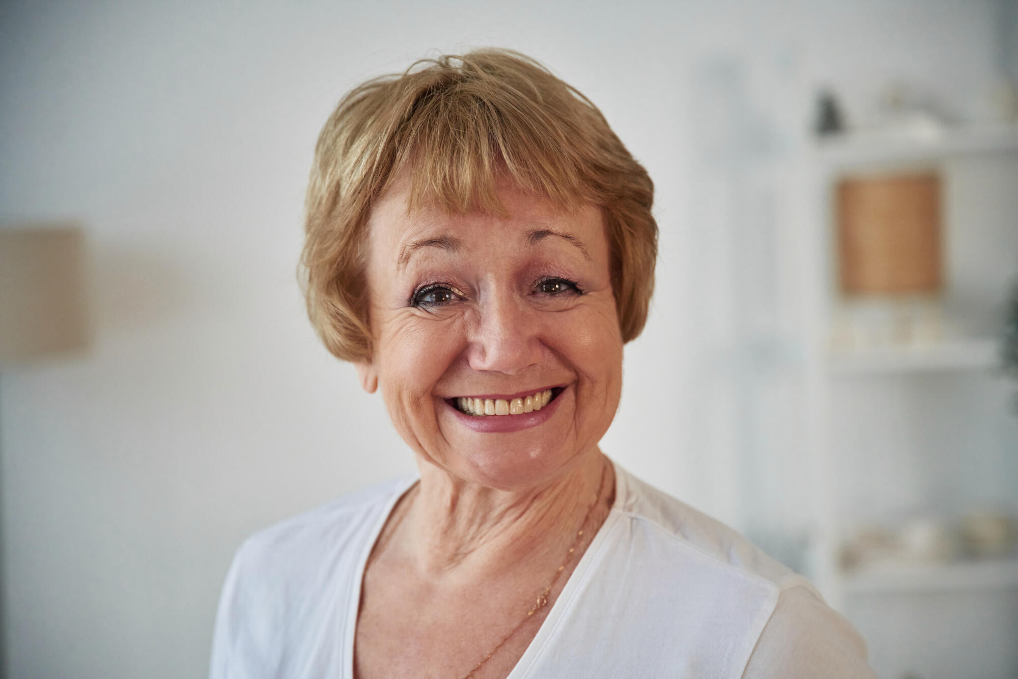 Portrait of senior elderly woman that is at home in the living room