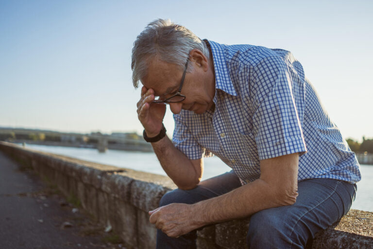 Worried senior man outside