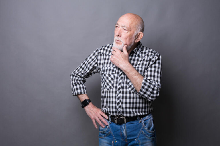 Pensive mature man looking away, copy space