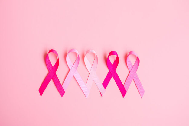 October Breast Cancer Awareness month, Pink Ribbon on pink backg October Breast Cancer Awareness month, Pink Ribbon on pink backg