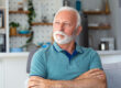 Bored tired sad mature man depressed lonely having no visitors of his children. Divorce , bachelor , health problems concept. Lockdown, unemployment, needless man on social distance