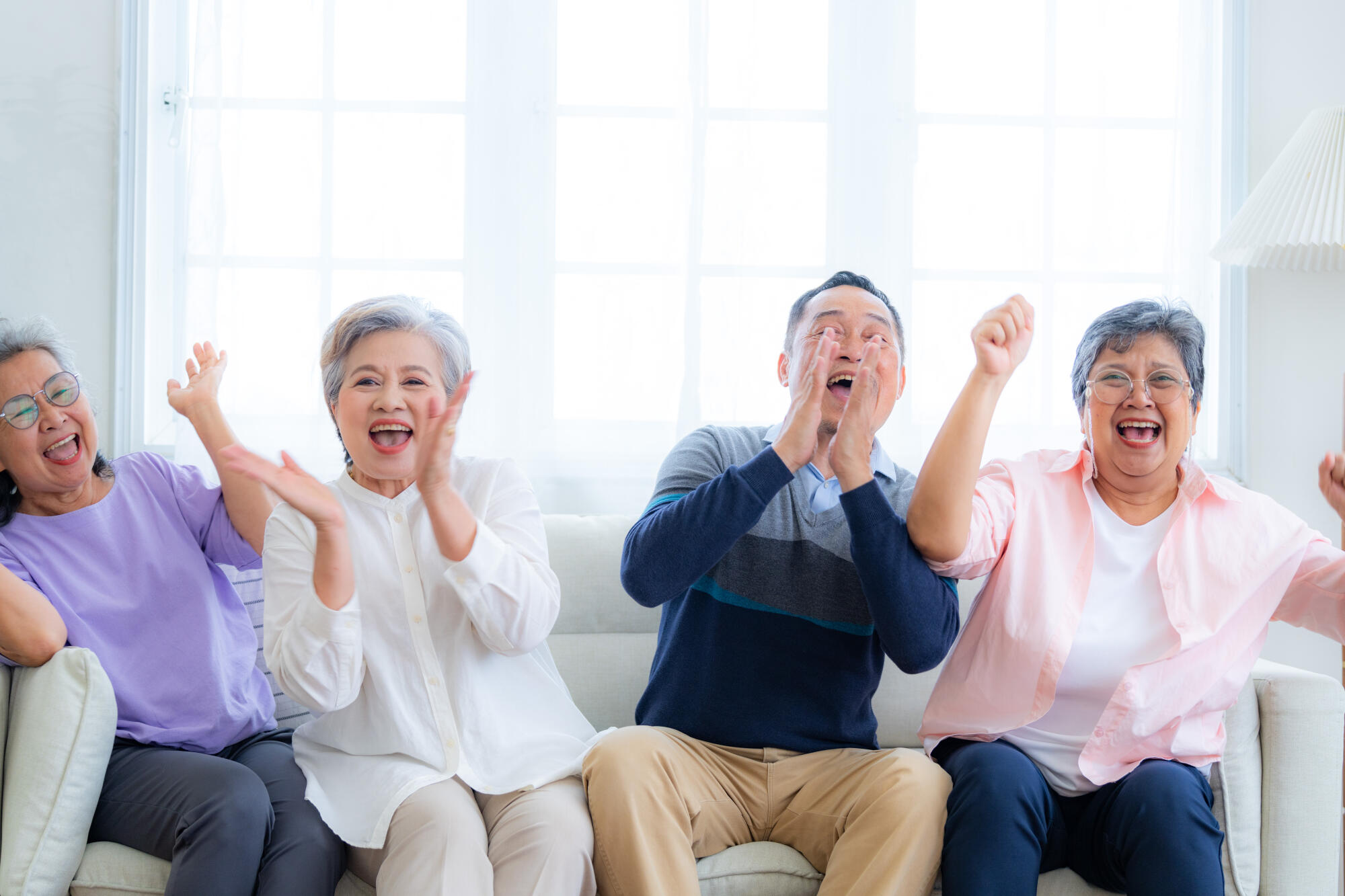 Happiness of the group females and male elderly sitting on the s