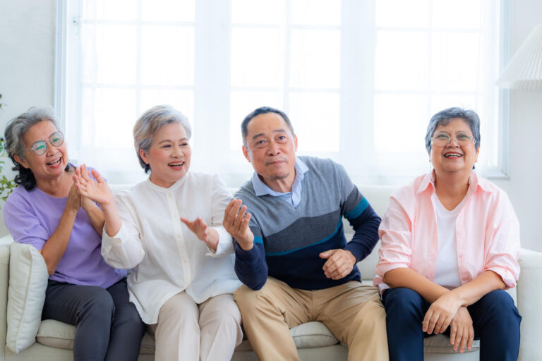 Happiness of the group females and male elderly sitting on the s