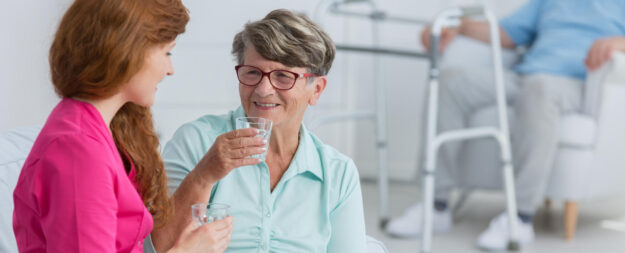 Woman,Taking,The,Medicine,In,Front,Of,Nurse Woman,Taking,The,Medicine,In,Front,Of,Nurse